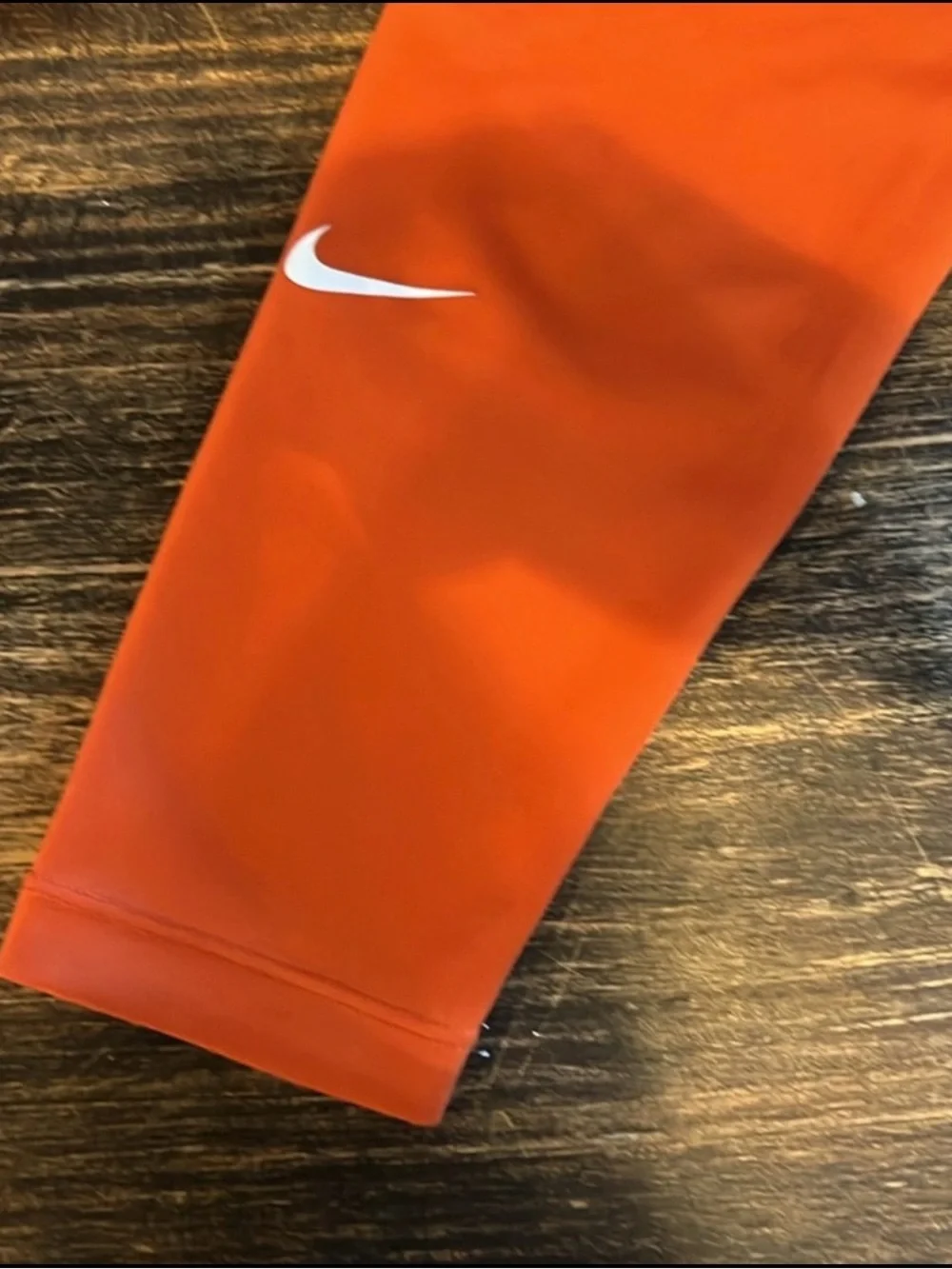 Nike Kids Orange Performance Leggings with White Swoosh